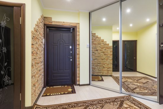 Mirrors on Sliding Glass Door in Luxury Home Hallway
